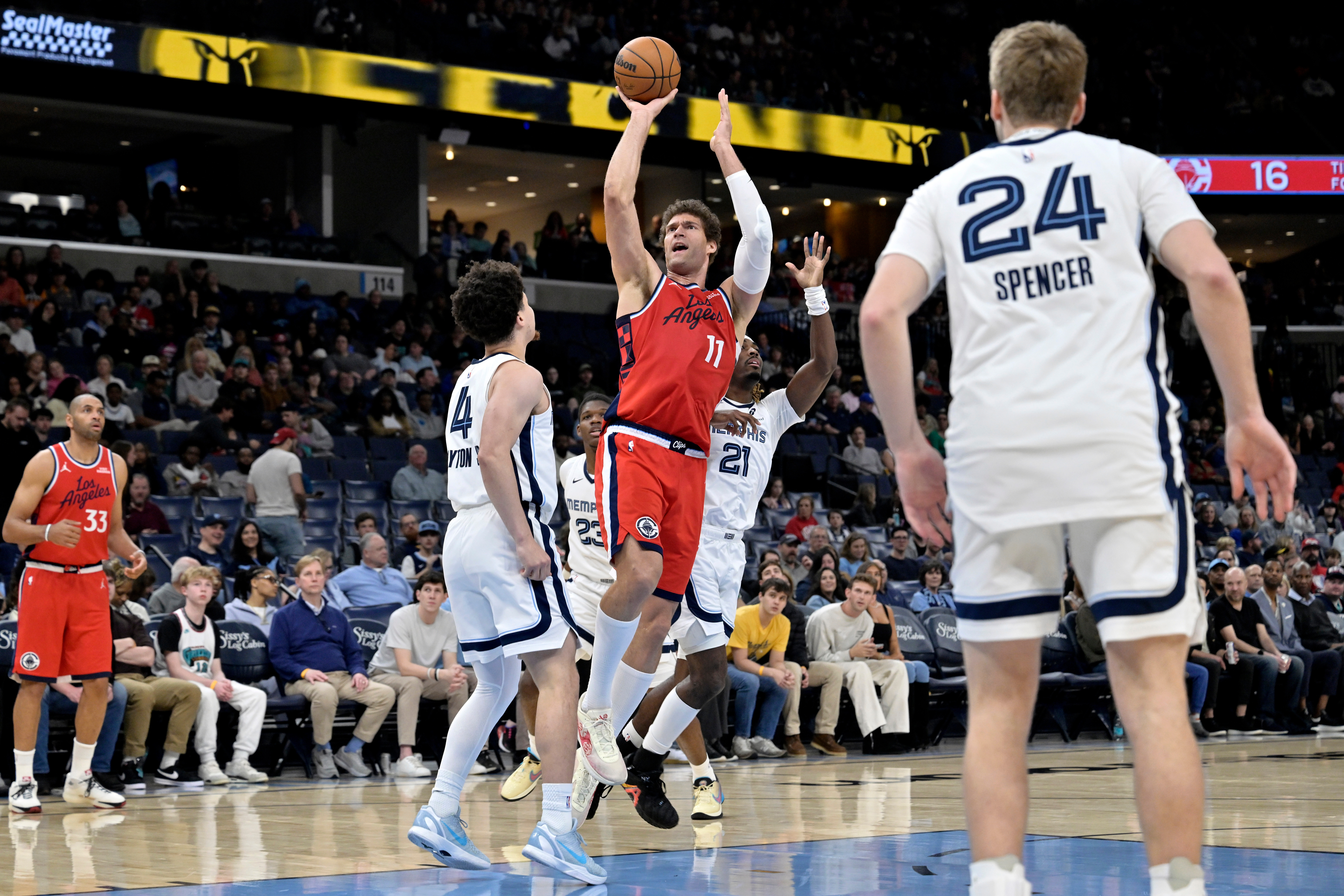 Clippers center Brook Lopez (11) shoots over Memphis Grizzlies guards...