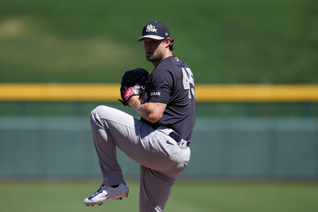 New York Yankees starting pitcher Gerrit Cole warms up during the first inning of a spring training baseball game against the Chicago Cubs, Tuesday, March 24, 2026, in Mesa, Ariz. 