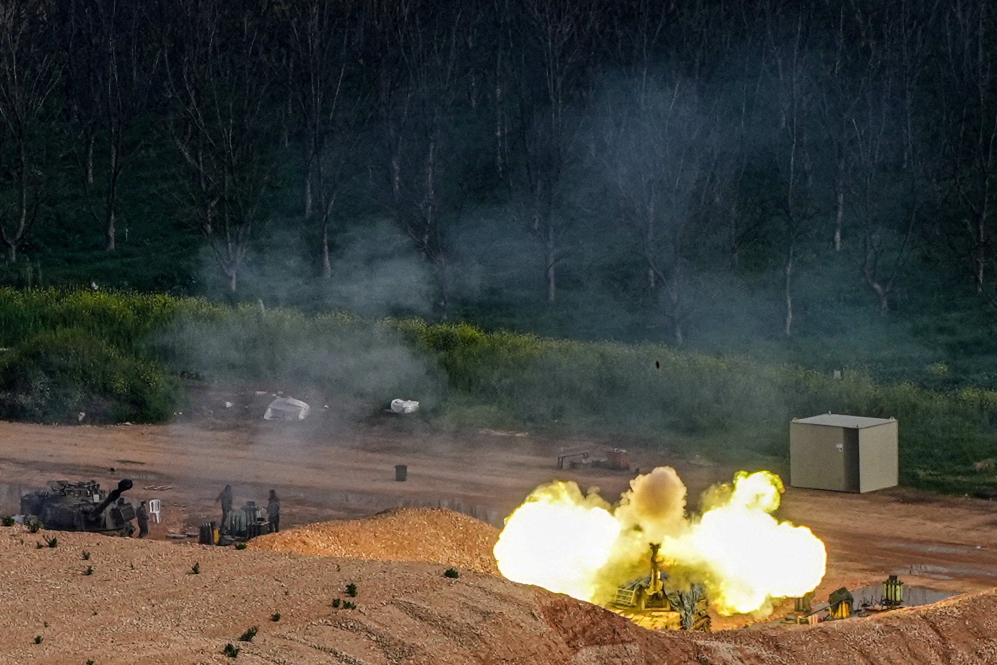 An Israeli artillery unit fires towards Lebanon, amid escalating hostilities between Israel and Hezbollah