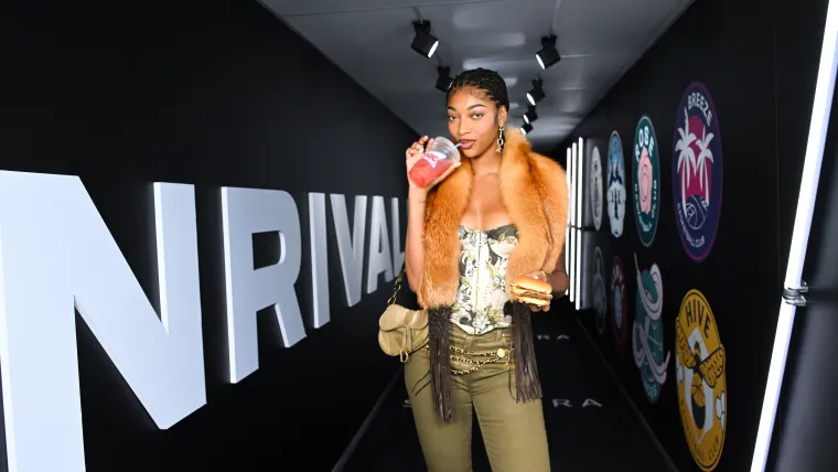 Angel Reese is all smiles as she packs a pre-game protein punch image