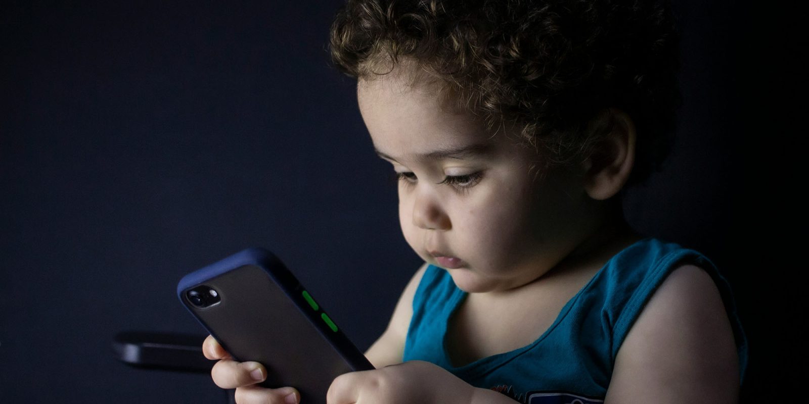 Apple age verification failing for some – here's what you need to know | Photo shows a child holding a phone