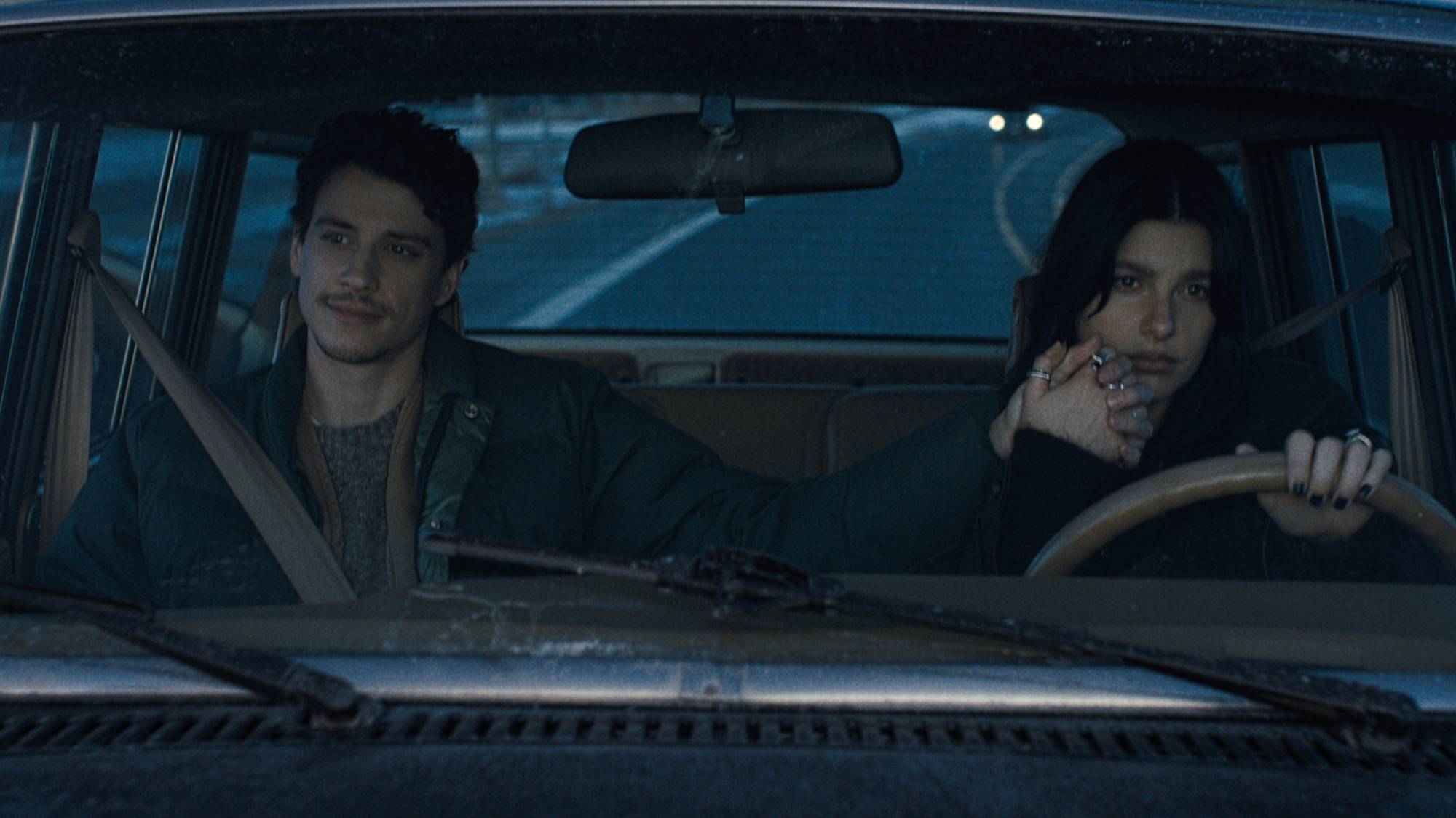 (L-R) Adam DiMarco as Nicky Cunningham and Camila Morrone as Rachel Harkin in "Something Very Bad Is Going to Happen"