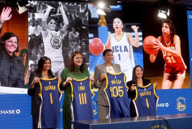 NBC Sports and Athletics broadcaster Jenny Cavnar, Warriors 1969 draft pick Denise Long Rife, Naismith Basketball Hall of Famer Cheryl Miller and Golden State Valkyries head coach Natalie Nakase, from left, pose with jerseys during a press conference before the Warriors NBA game against the LA Clippers at the Chase Center in San Francisco, Calif., on Monday, March 2, 2026. (Jane Tyska/Bay Area News Group)