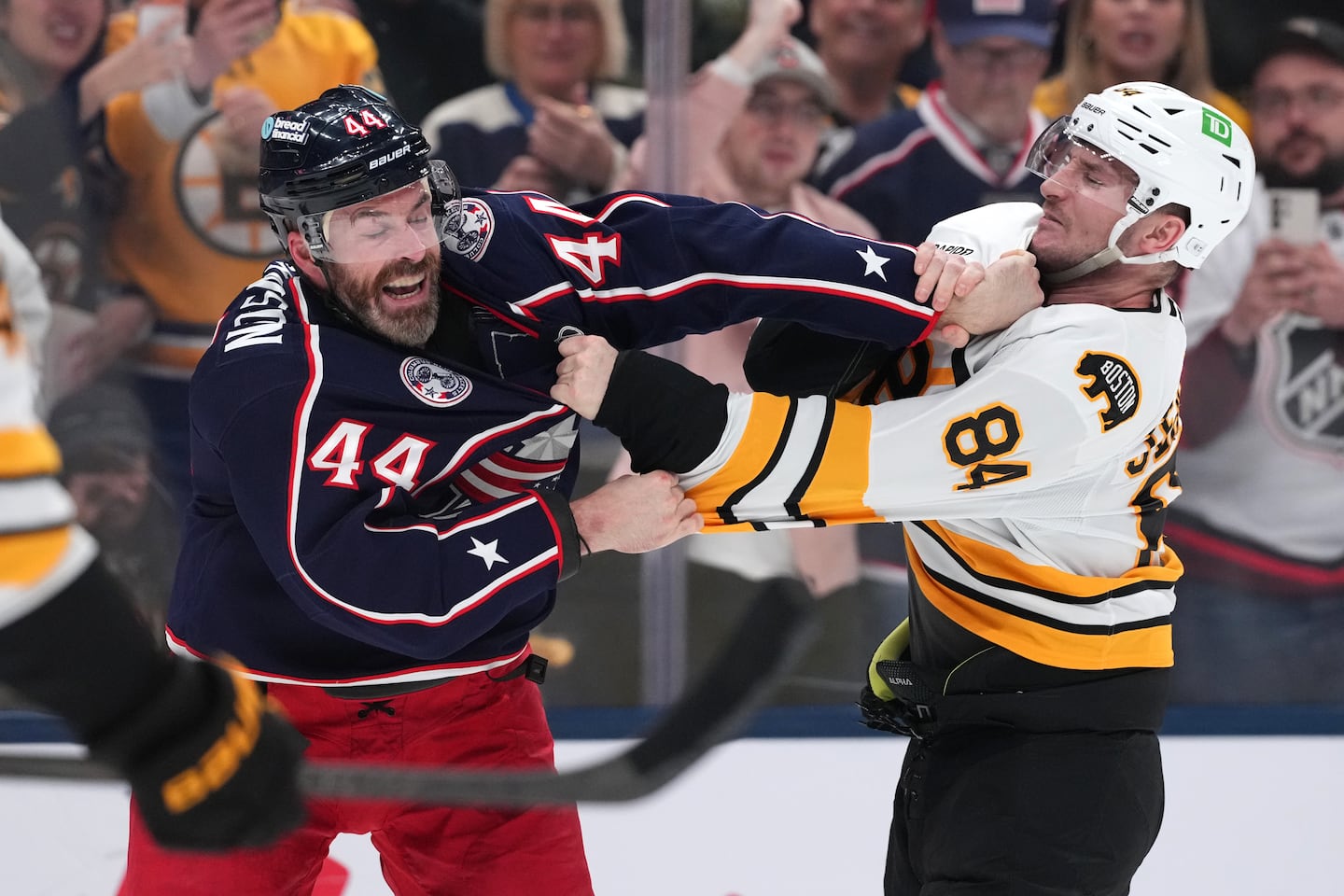 Bruin forward Tanner Jeannot (right) drops the gloves with Blue Jacket big-man Erik Gudbranson during Sunday's clash in Columbus, Ohio. 