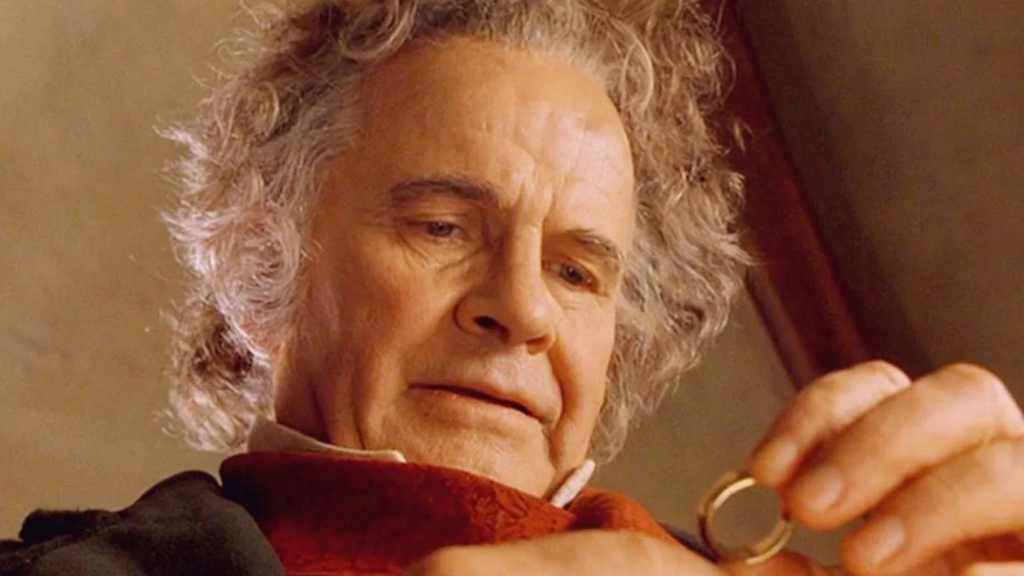 Bilbo Baggins holding the One Ring in The Lord of the Rings.