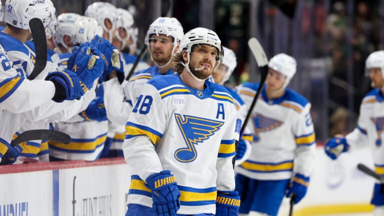 St. Louis Blues center Robert Thomas reacts after scoring an empty-net goal during the third period of an NHL hockey game against the Minnesota Wild, Sunday, March 1, 2026, in St. Paul, Minn.