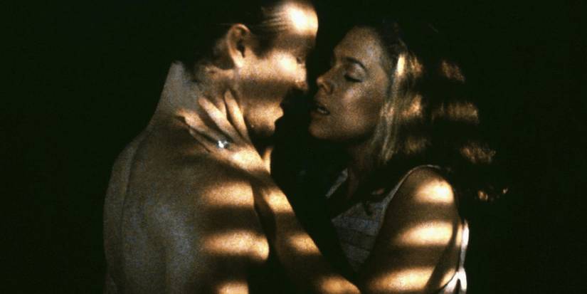 Ned and Matty embracing in the shadows in Body Heat