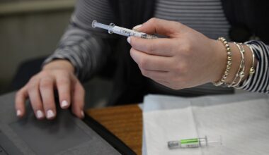 Flu and COVID vaccines were prepared at Boston City Hall, in January.