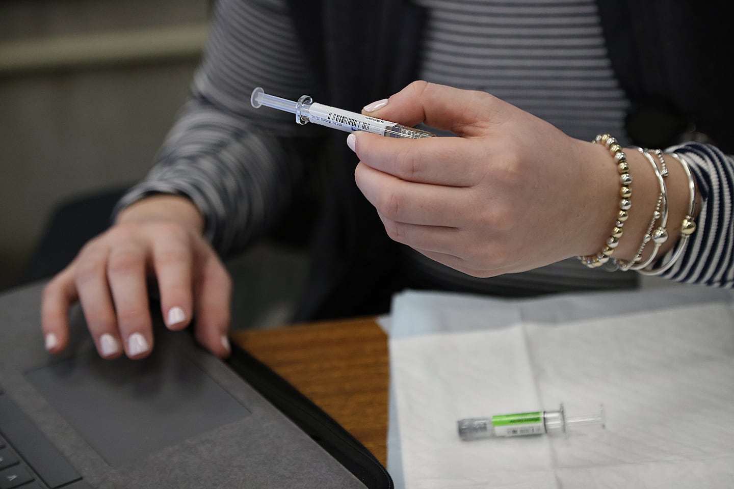 Flu and COVID vaccines were prepared at Boston City Hall, in January.