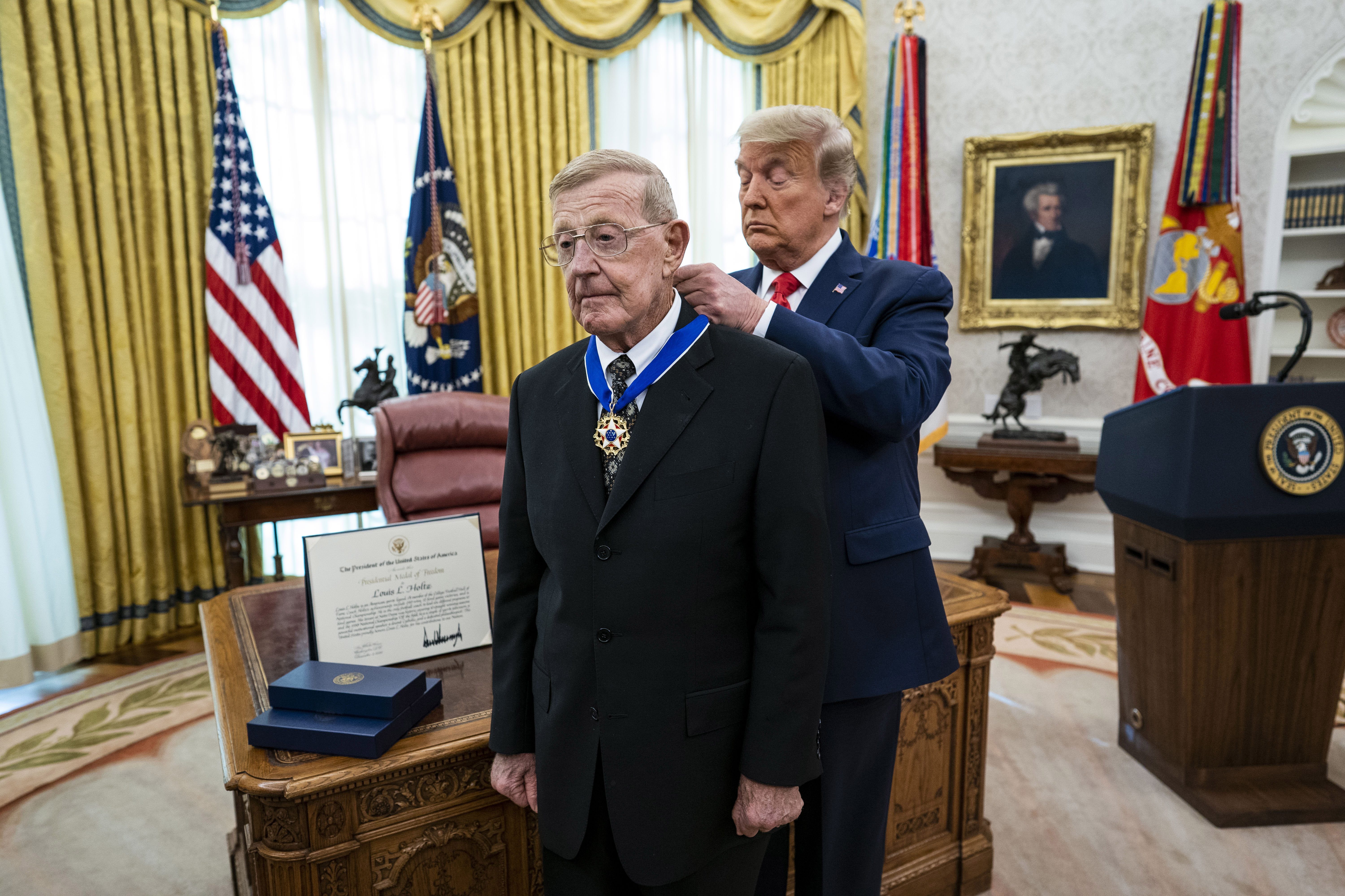 Lou Holtz, the famed college football coach, is presented with...