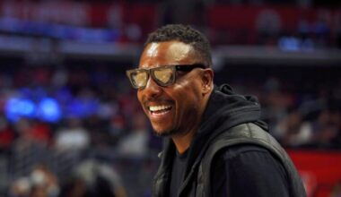 FILE - Former NBA basketball player Paul Pierce smiles watching warmups before an NBA basketball game between the Los Angeles Clippers and the Chicago Bulls, Nov. 14, 2021, in Los Angeles.