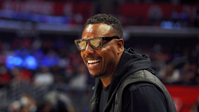 FILE - Former NBA basketball player Paul Pierce smiles watching warmups before an NBA basketball game between the Los Angeles Clippers and the Chicago Bulls, Nov. 14, 2021, in Los Angeles.