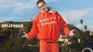 Timothée Chalamet in the Marty Supreme tracksuit designed by Doni Nahmias