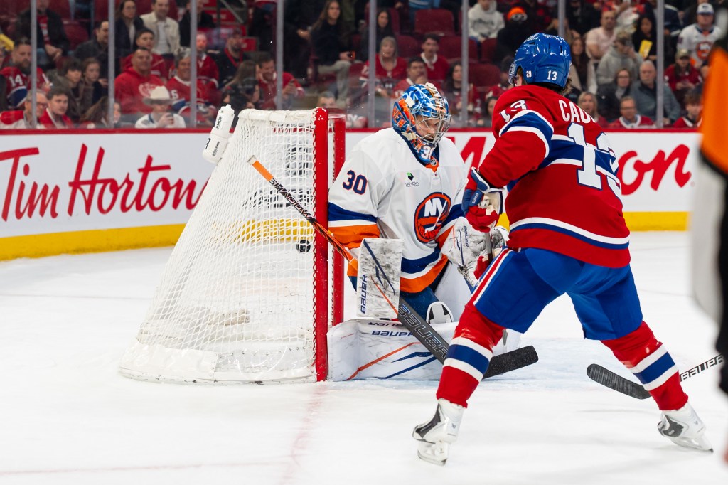 Cole Caufield (13) scores on Ilya Sorokin during the second period for the first of his three goals in the Islanders' 7-3 blowout loss to the Canadiens on March 21, 2026  in Montreal.