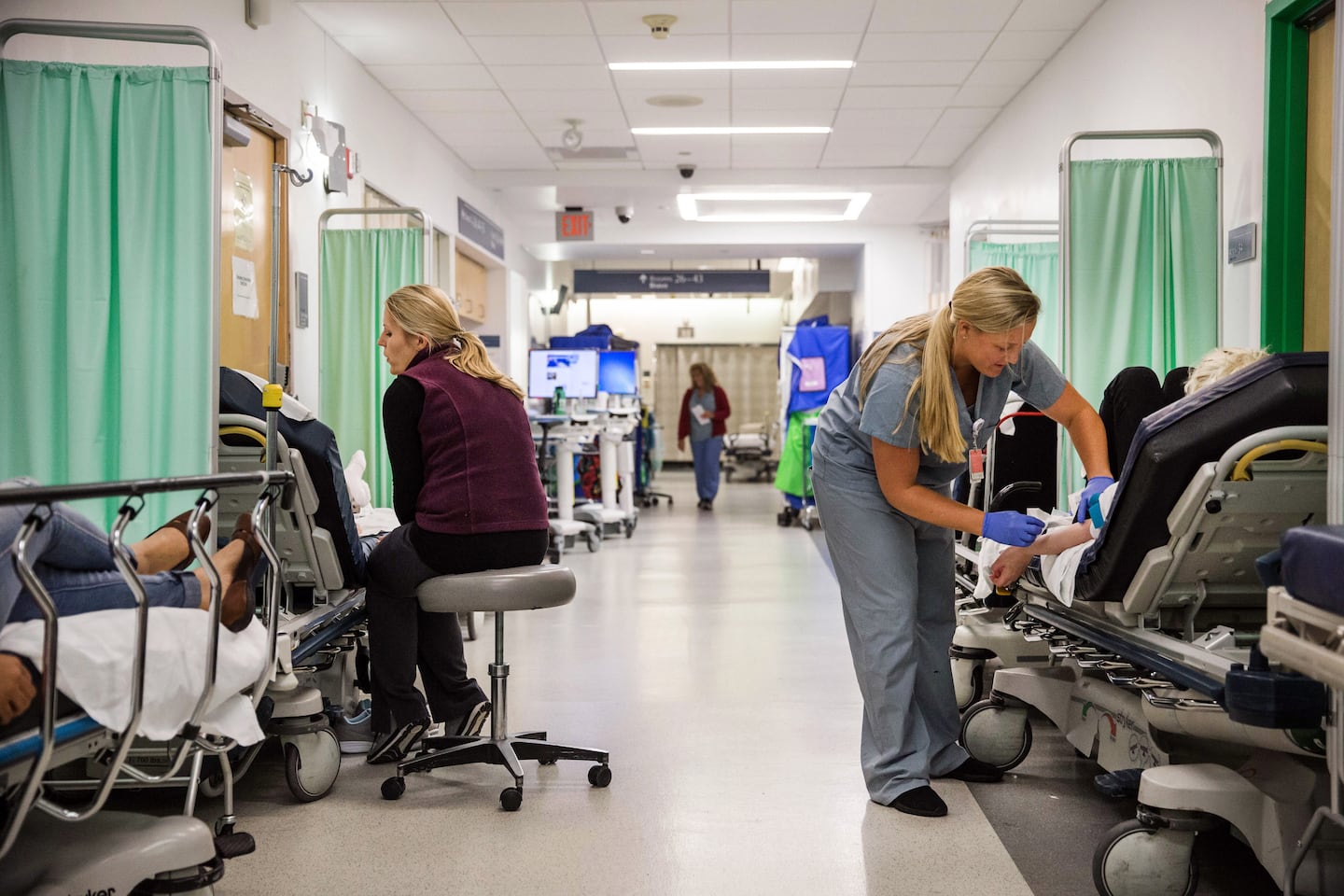 Patient beds lined a hallway in 2019 in the emergency department at Brigham and Women's Hospital in Boston. 