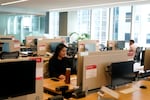 FILE - People work at the Yelp office in San Francisco on Feb. 14, 2023. Remote work has intensified loneliness in the workplace. Experts say friendships and a sense of belonging are vital to employees’ happiness. And also to companies’ success.