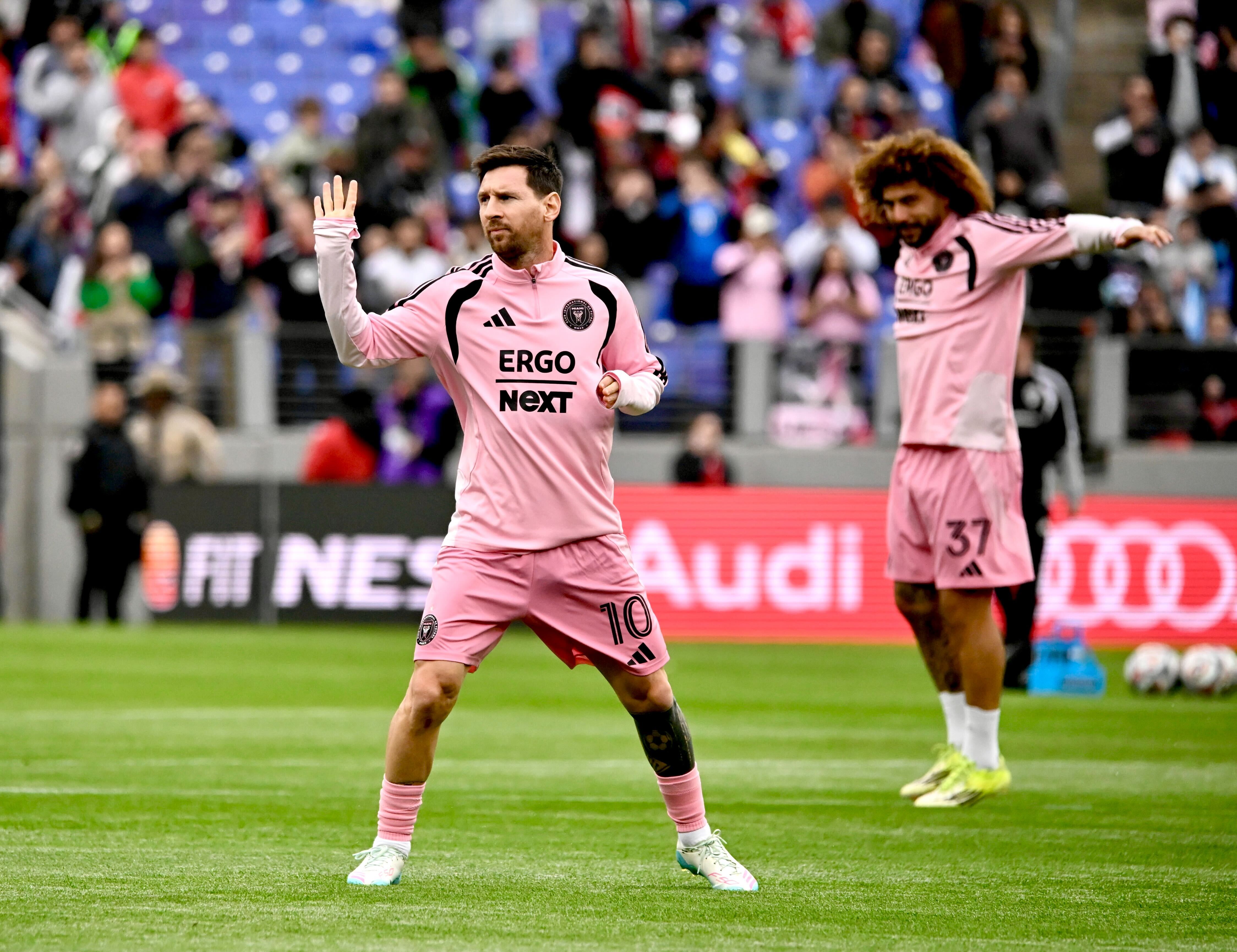 Inter Miami star Lionel Messi waves to fans during warmups...