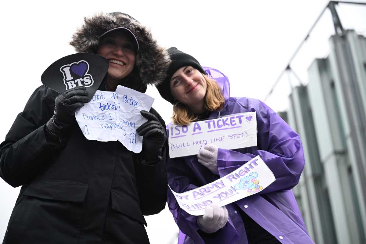 Fans waited in the rain at Pier 17 for a chance to hear BTS.