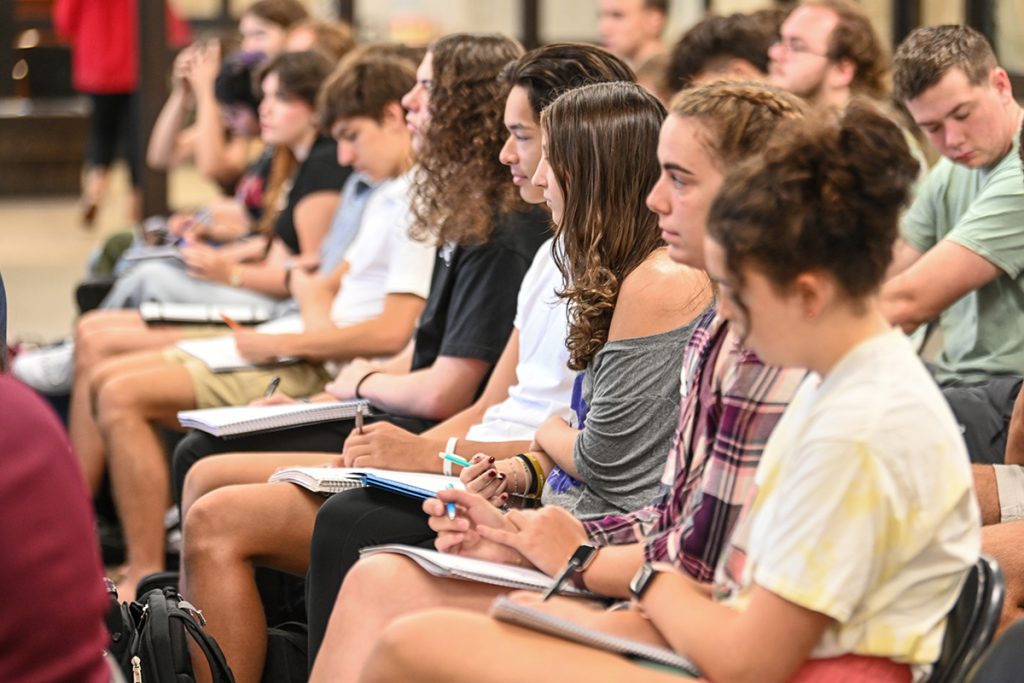 University Honors Global Scholars students take notes during a guest lecture.