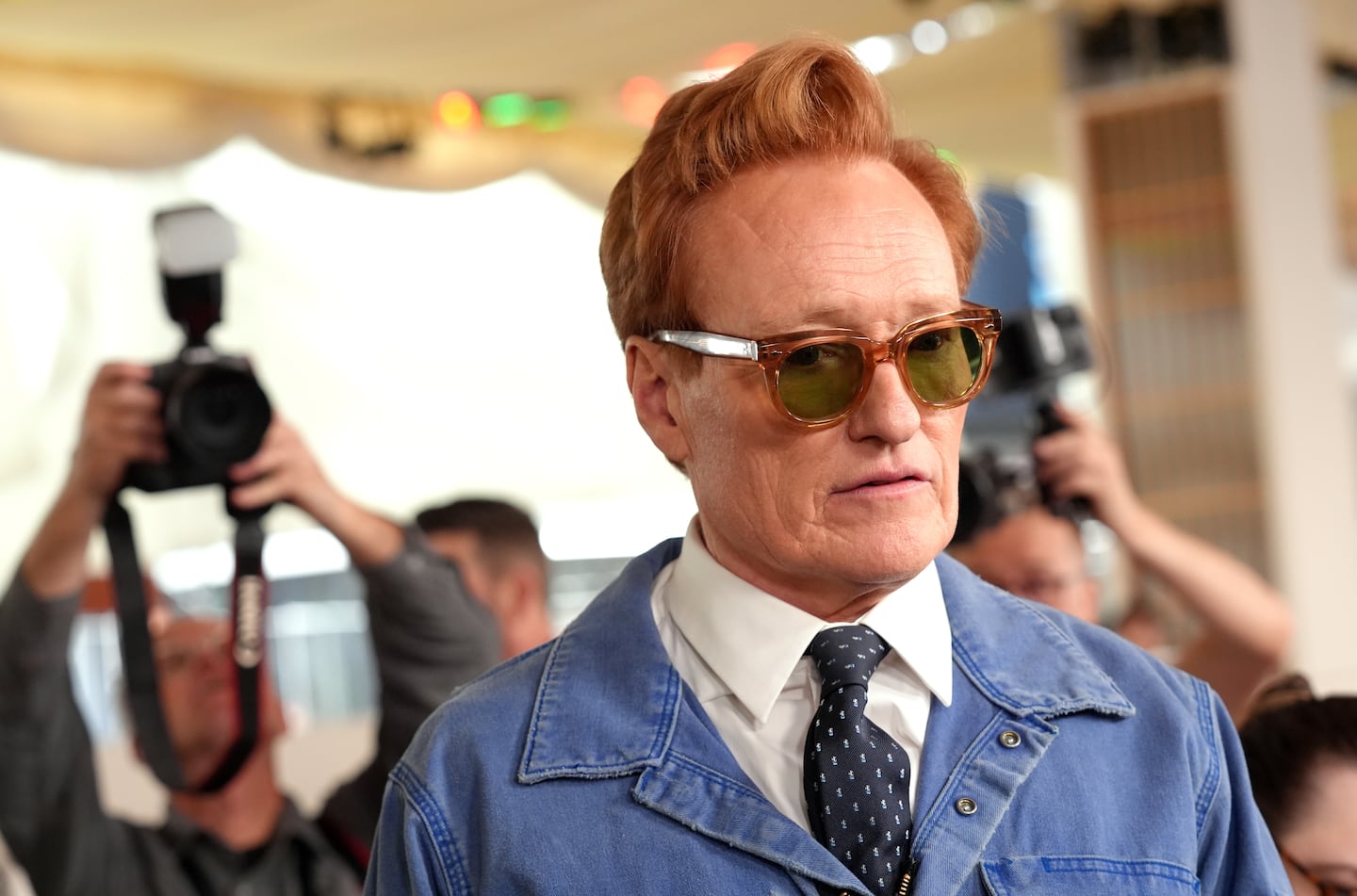 Academy Awards host Conan O'Brien is interviewed after rolling out the red carpet for Sunday's Oscars telecast, on Wednesday at the Dolby Theatre in Los Angeles.