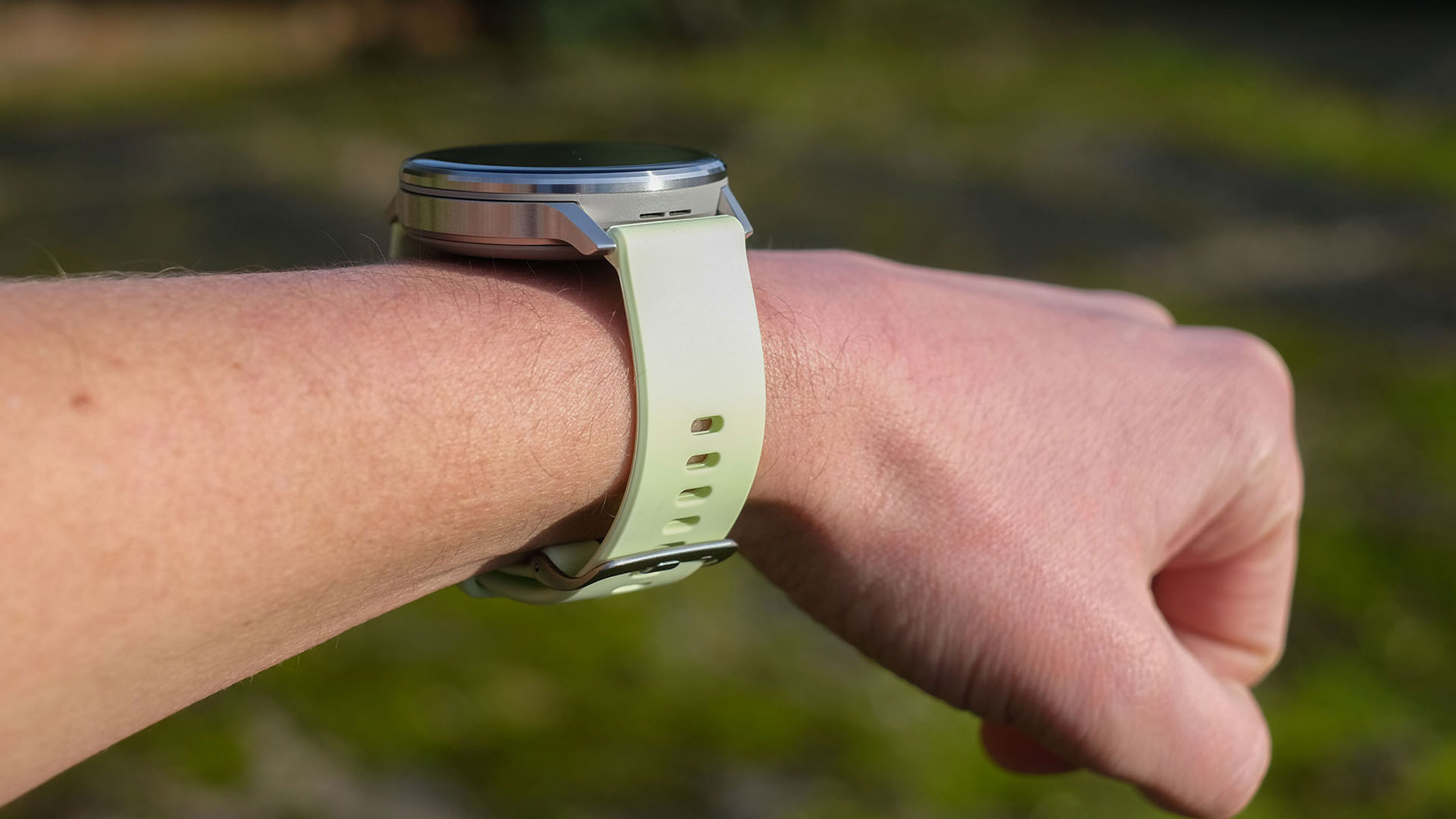 a close-up picture of our reviewer testing the Garmin Venu 4 smartwatch
