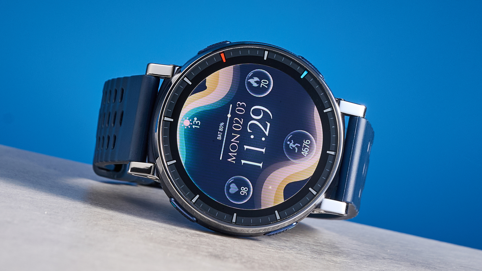 the amazfit active 3 premium photographed against the blue tom's guide background