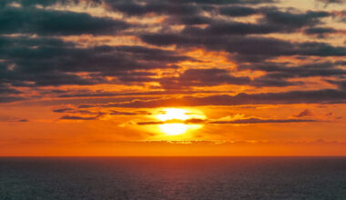 The sun sets over the Arctic Ocean near the North Cape in Norway. Credit: Soeren Stache/picture alliance via Getty Images