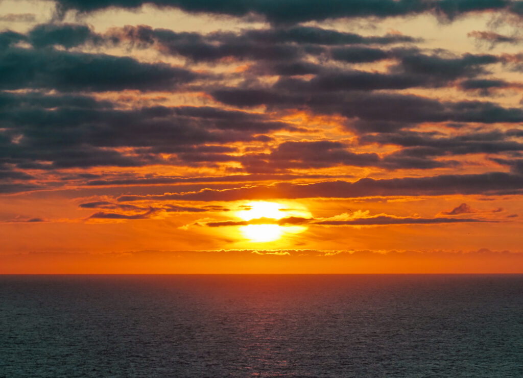 The sun sets over the Arctic Ocean near the North Cape in Norway. Credit: Soeren Stache/picture alliance via Getty Images