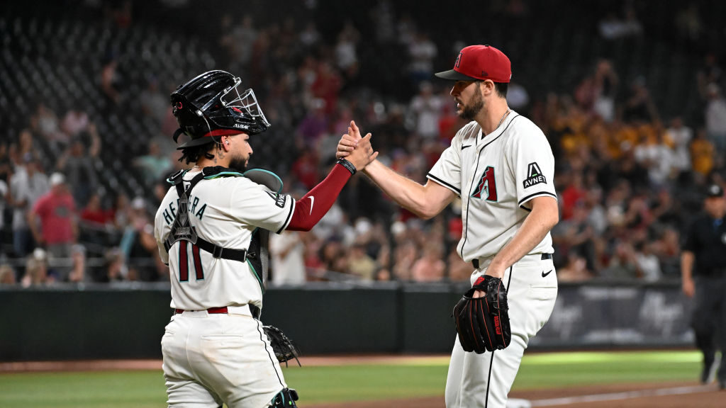 Jose Herrera #11 and Ryan Thompson #81 of the Arizona Diamondbacks celebrate a 5-4 win against the ...