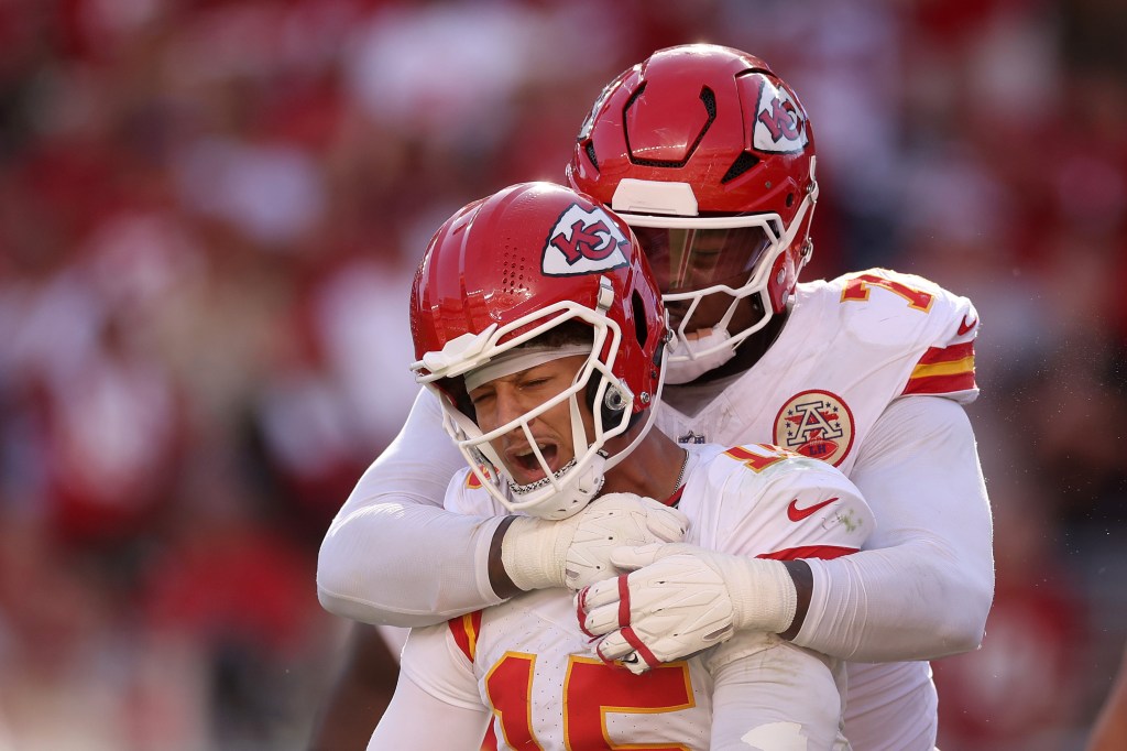Patrick Mahomes embraces teammate after touchdown.