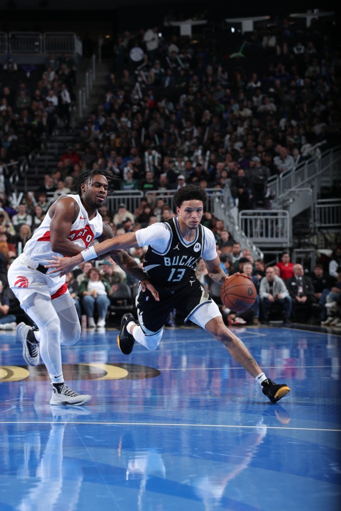 Ryan Rollins dribbles the ball