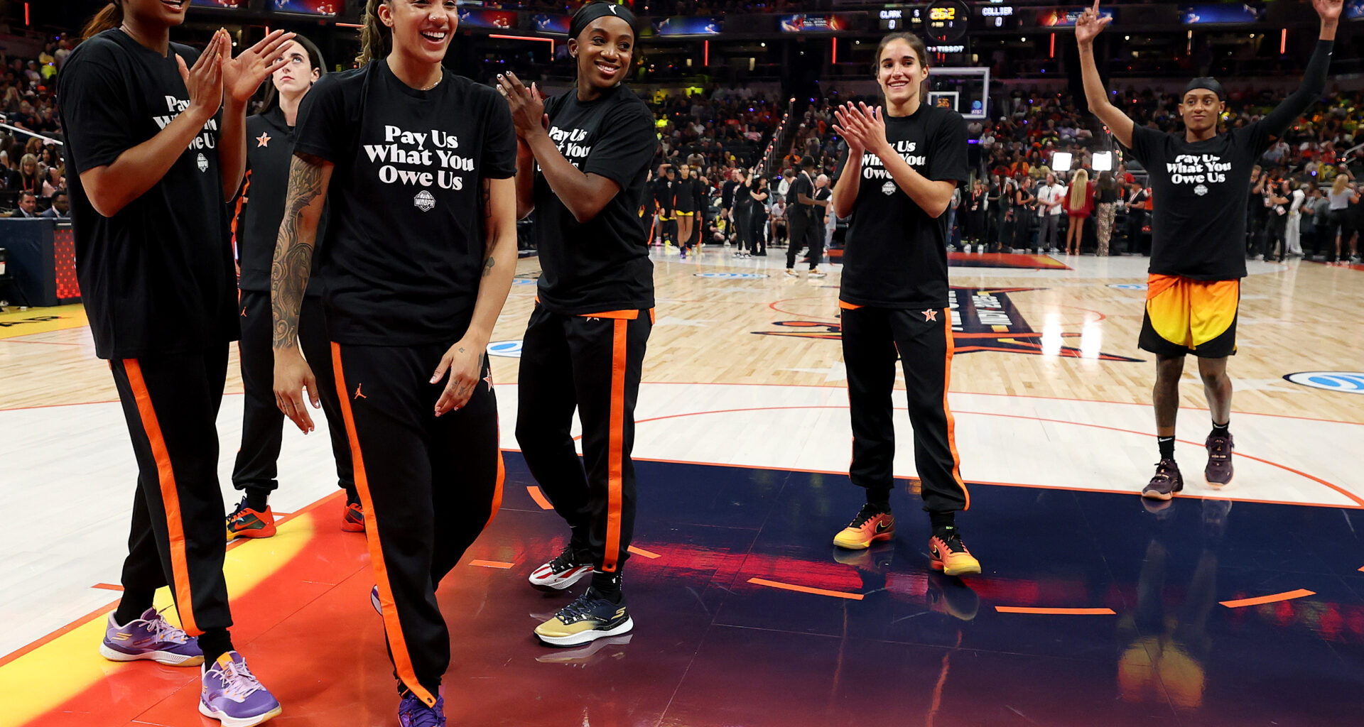 Howard players celebrate their victory in the locker room