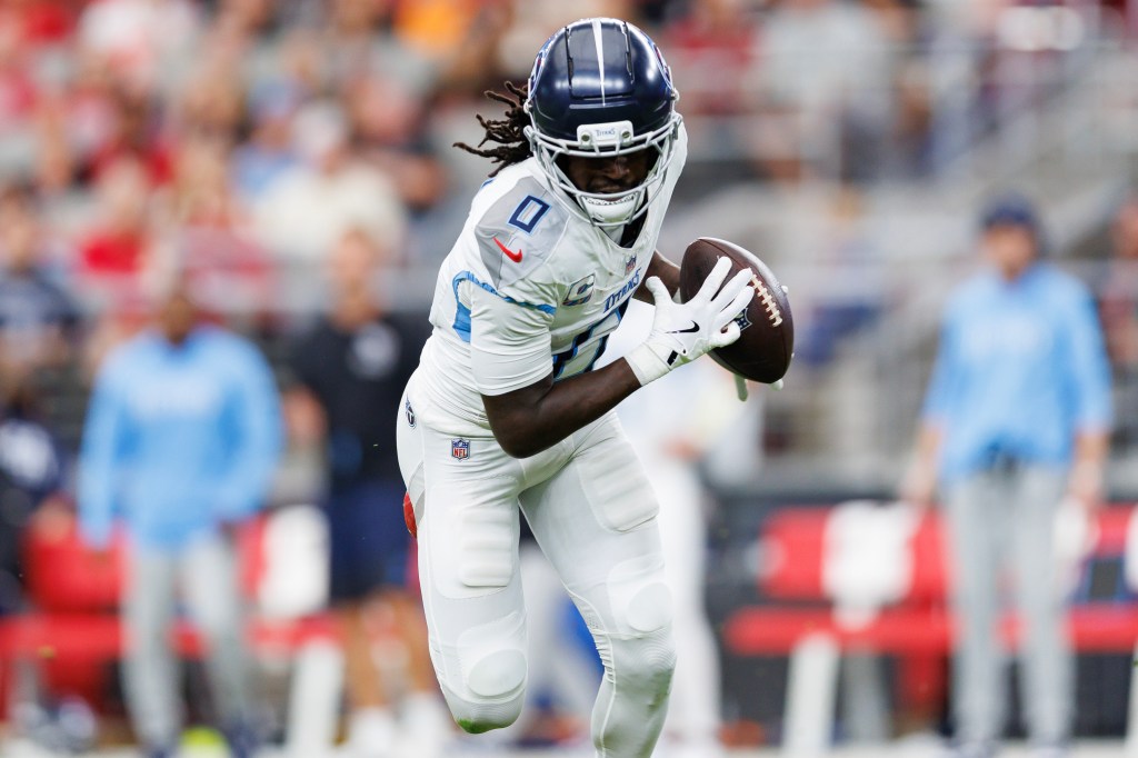 Calvin Ridley #0 of the Tennessee Titans completes a catch during the second half of an NFL football game against the Arizona Cardinals at State Farm Stadium on October 05, 2025 in Glendale, Arizona.