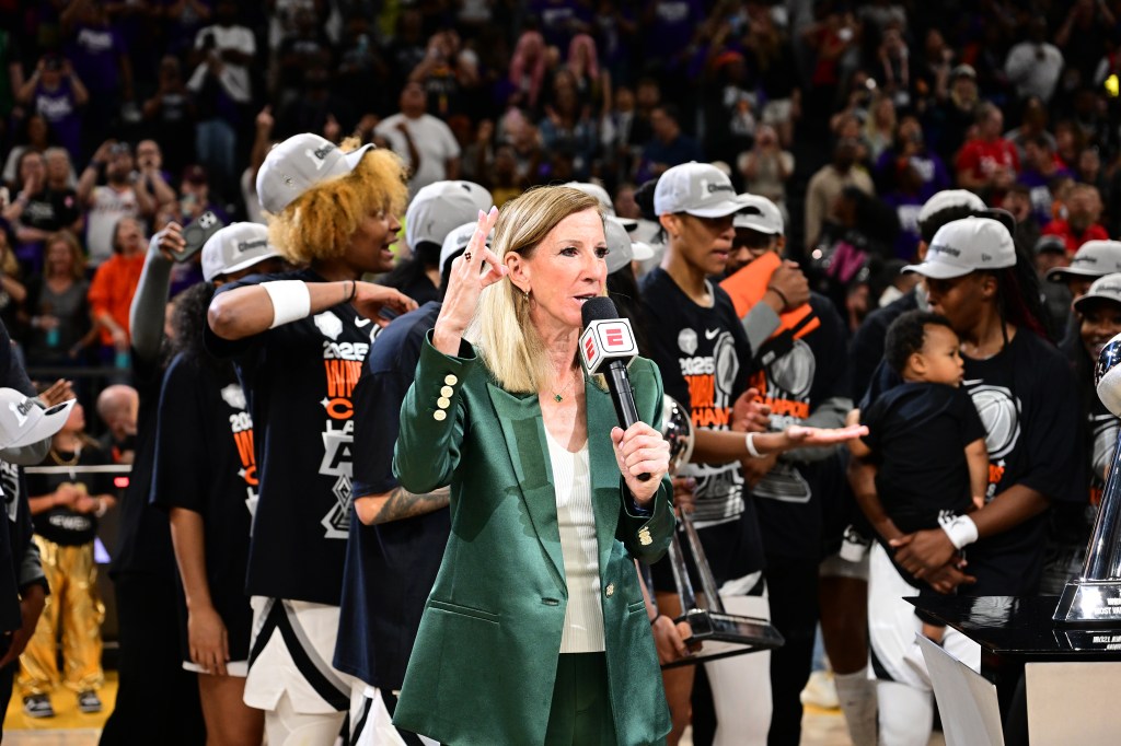 WNBA Commissioner Cathy Engelbert presents trophy to the Las Vegas Aces after the game against the Phoenix Mercury during Game Four of the WNBA Finals on October 10, 2025 at PHX Arena in Phoenix, Arizona.