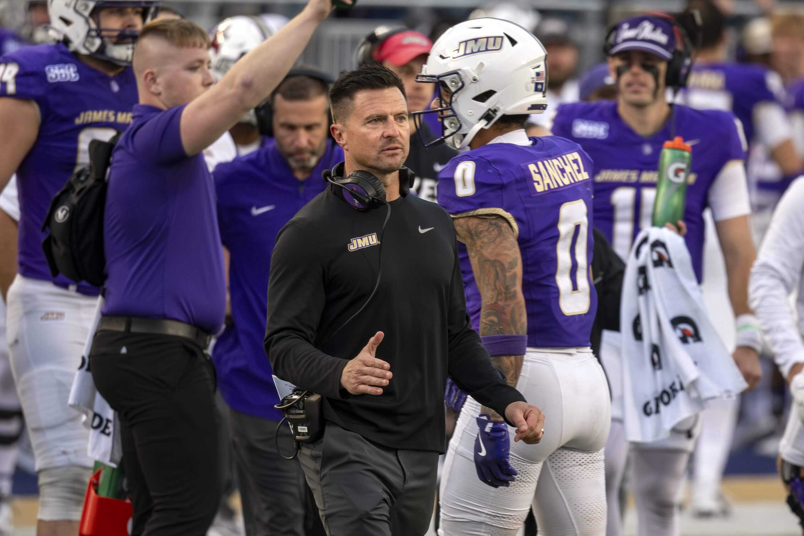 Bob Chesney reacts in front of James Madison players