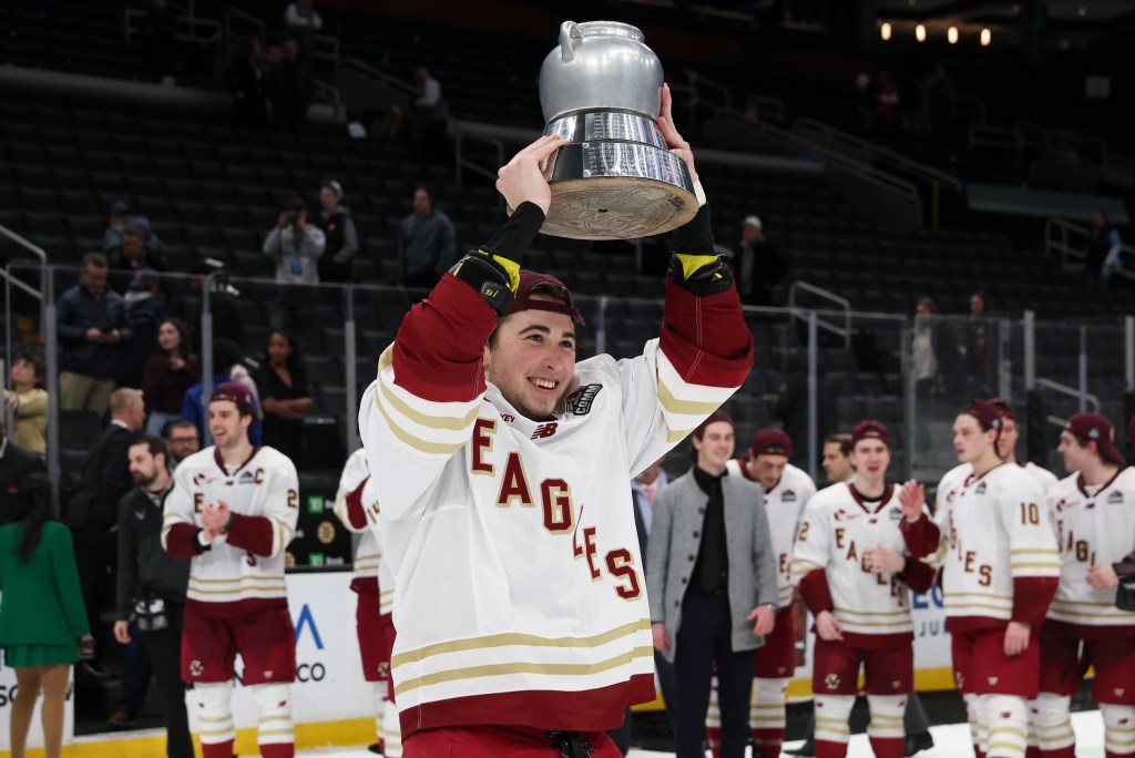 Drew Fortescue #5 of the Boston College Eagles skates with the Beanpot following their 6-2 win against the Boston University Terriers during the championship game of the annual Beanpot Hockey Tournament at TD Garden on February 9, 2026 in Boston, Massachusetts. 
