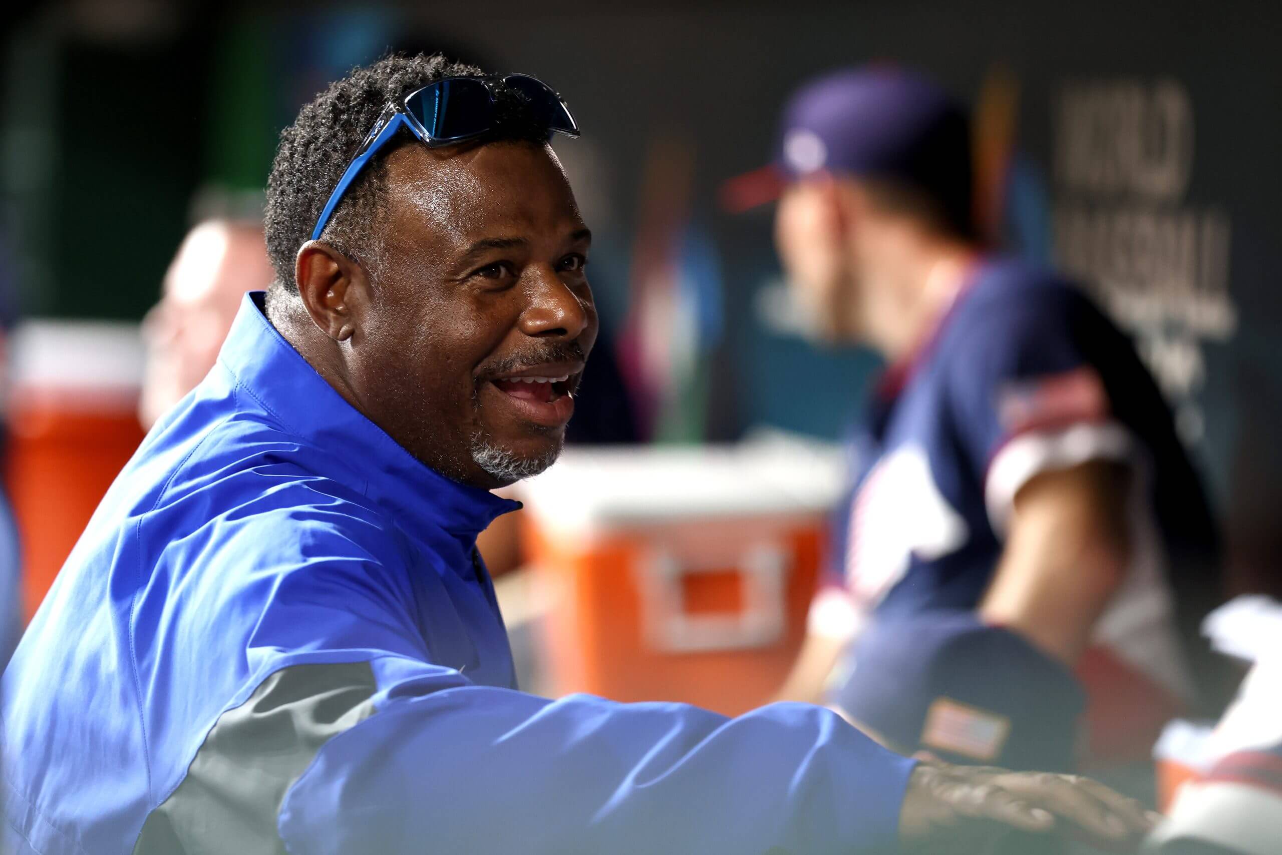 Ken Griffey Jr. shakes hands with players in the Team USA dugout.