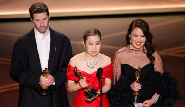 Chris Appelhans, Maggie Kang and Michelle Wong at the 98th Annual Oscars held at Dolby Theatre on March 15, 2026 in Hollywood, California.