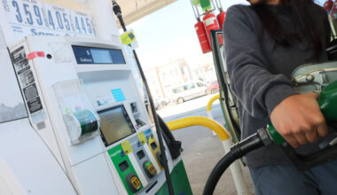 A person pumps gas at a BP station on Tuesday in the Kensington neighborhood of Brooklyn in New York City. Michael M. Santiago/Getty Images