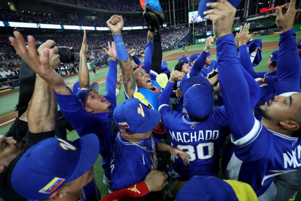 MIAMI, FLORIDA - MARCH 17: Members of Team Venezuela celebrate after the 3-2 victory against Team United States at loanDepot park on March 17, 2026 in Miami, Florida. (Photo by Al Bello/Getty Images)