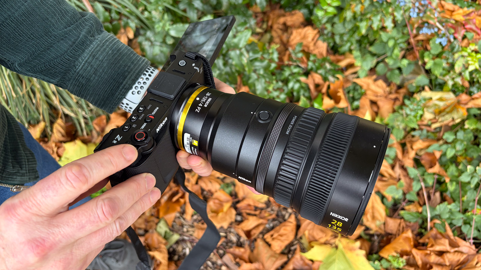 Person holding a Nikon ZR with Z 28-135mm f/4 PZ lens