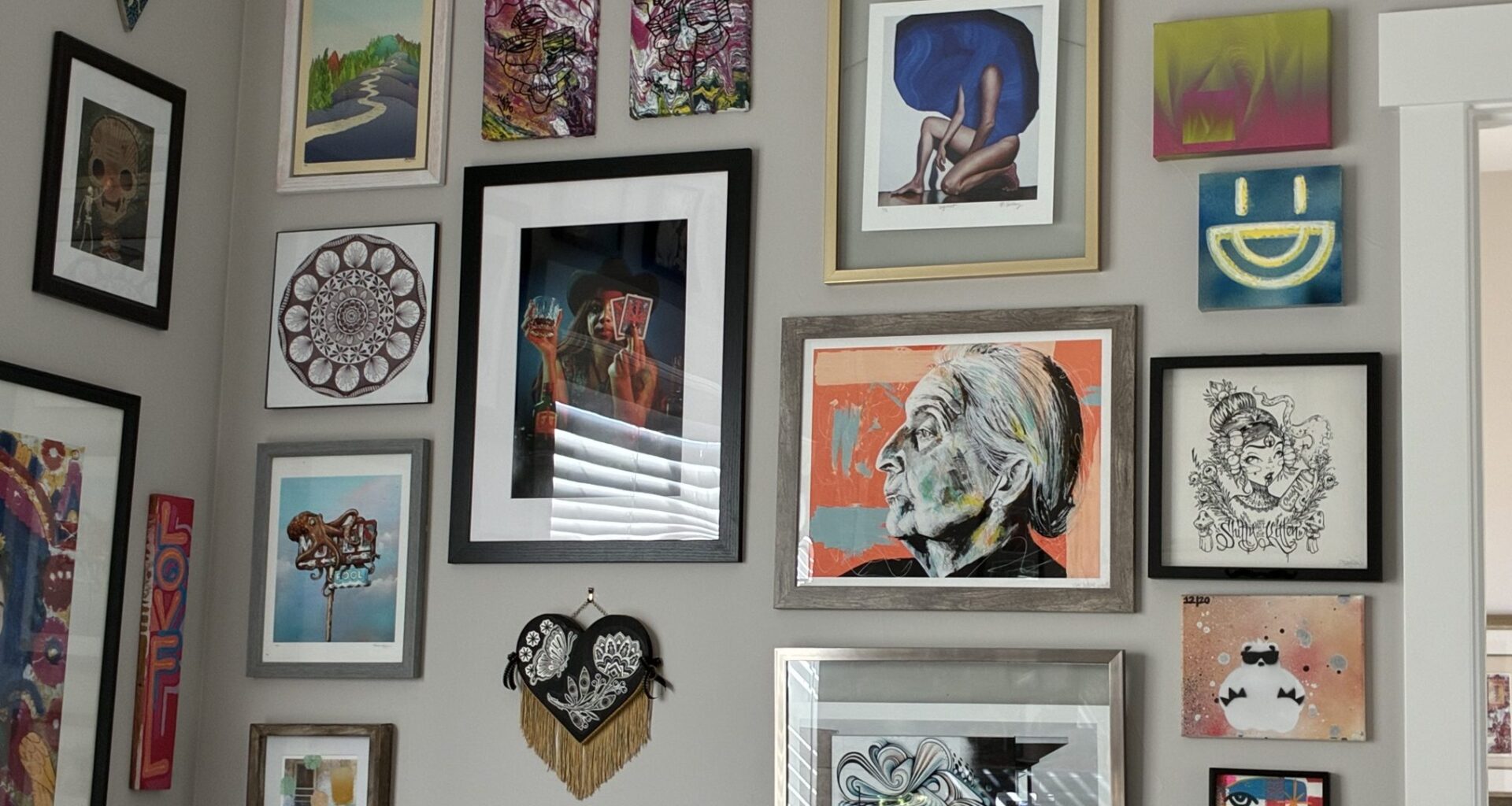 A wall of artwork collected by Denver art lover Sharon Connors.