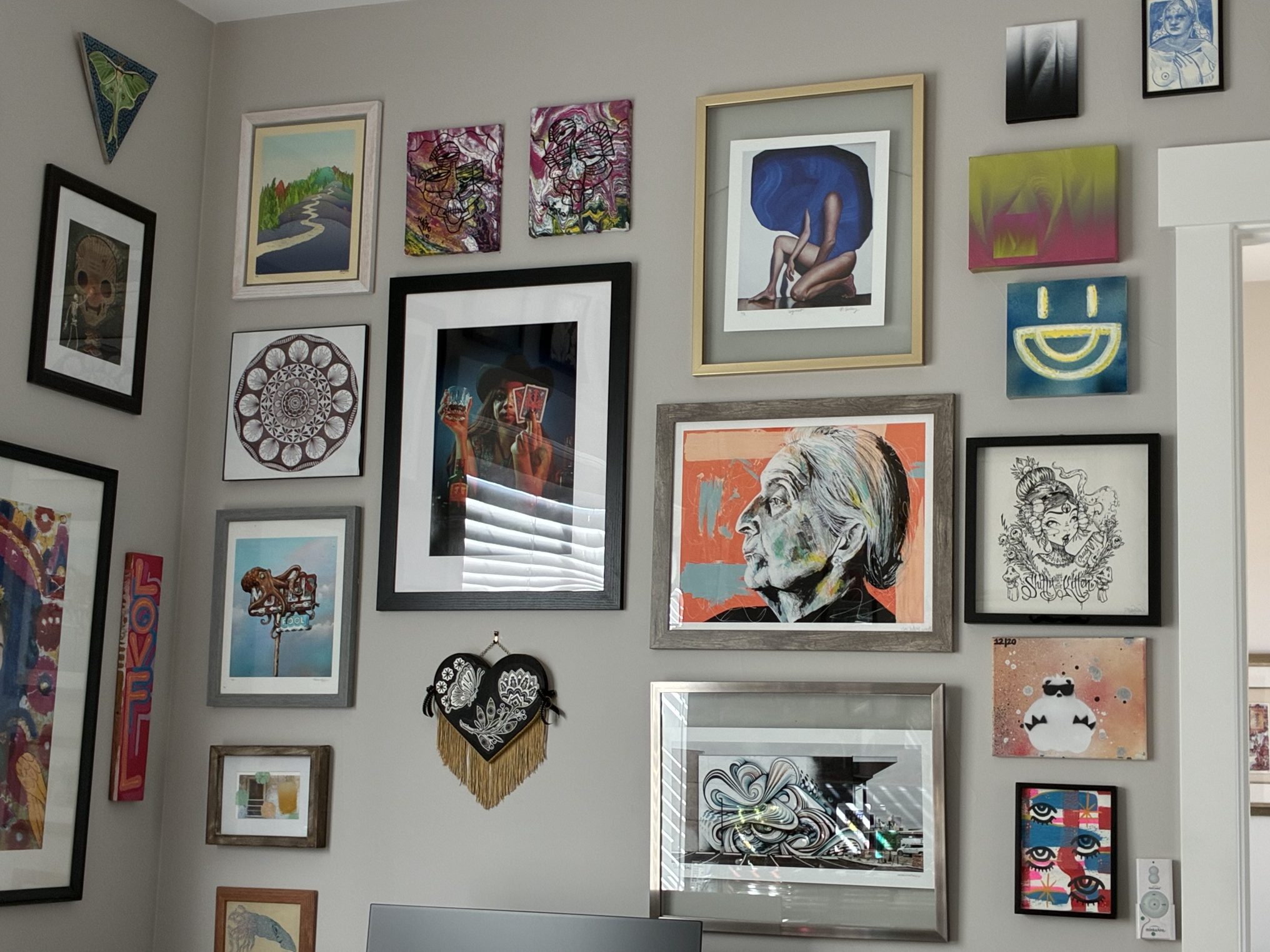 A wall of artwork collected by Denver art lover Sharon Connors.