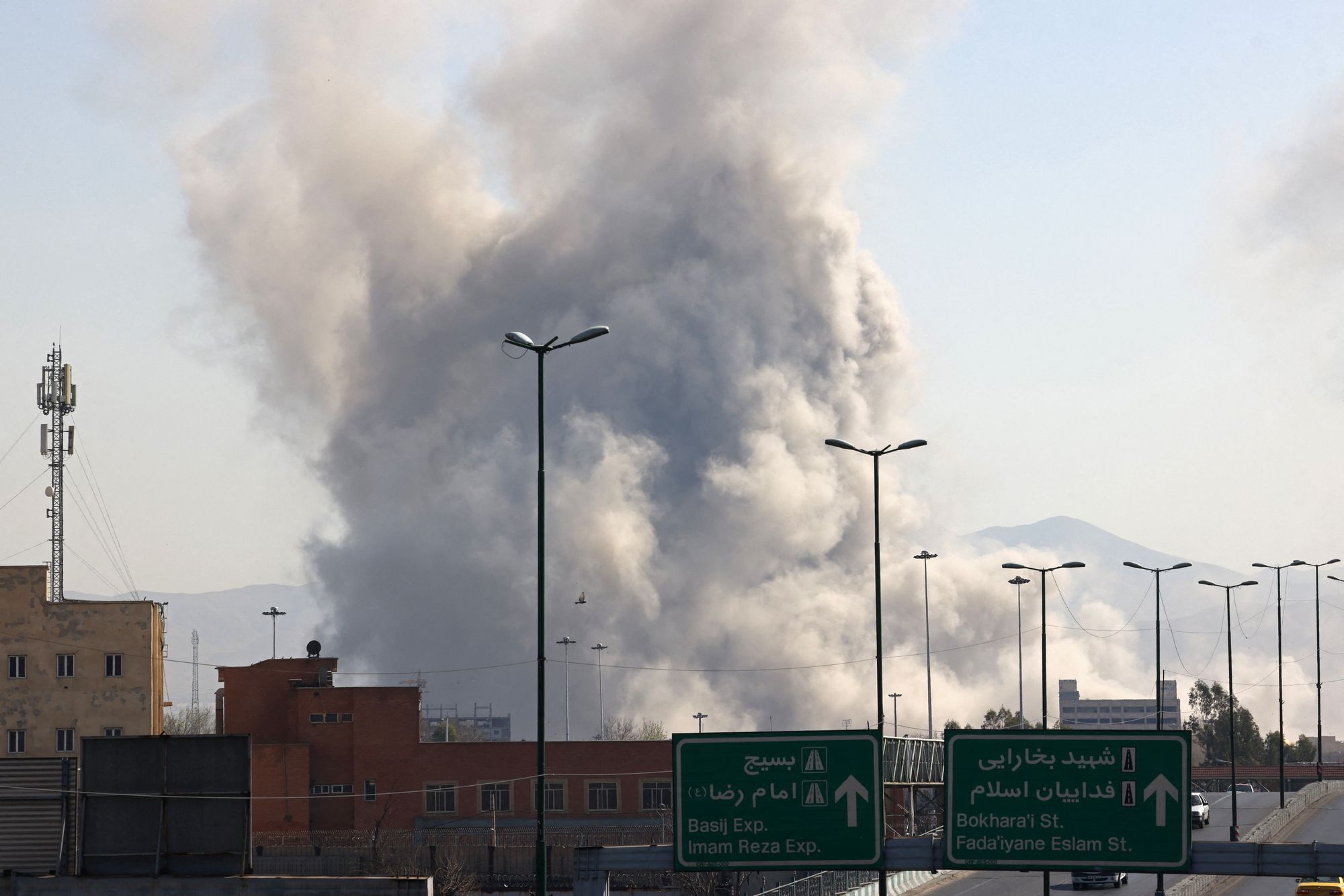 Smoke billows over Tehran following strikes, as the US and Israel expand their attacks on Iran