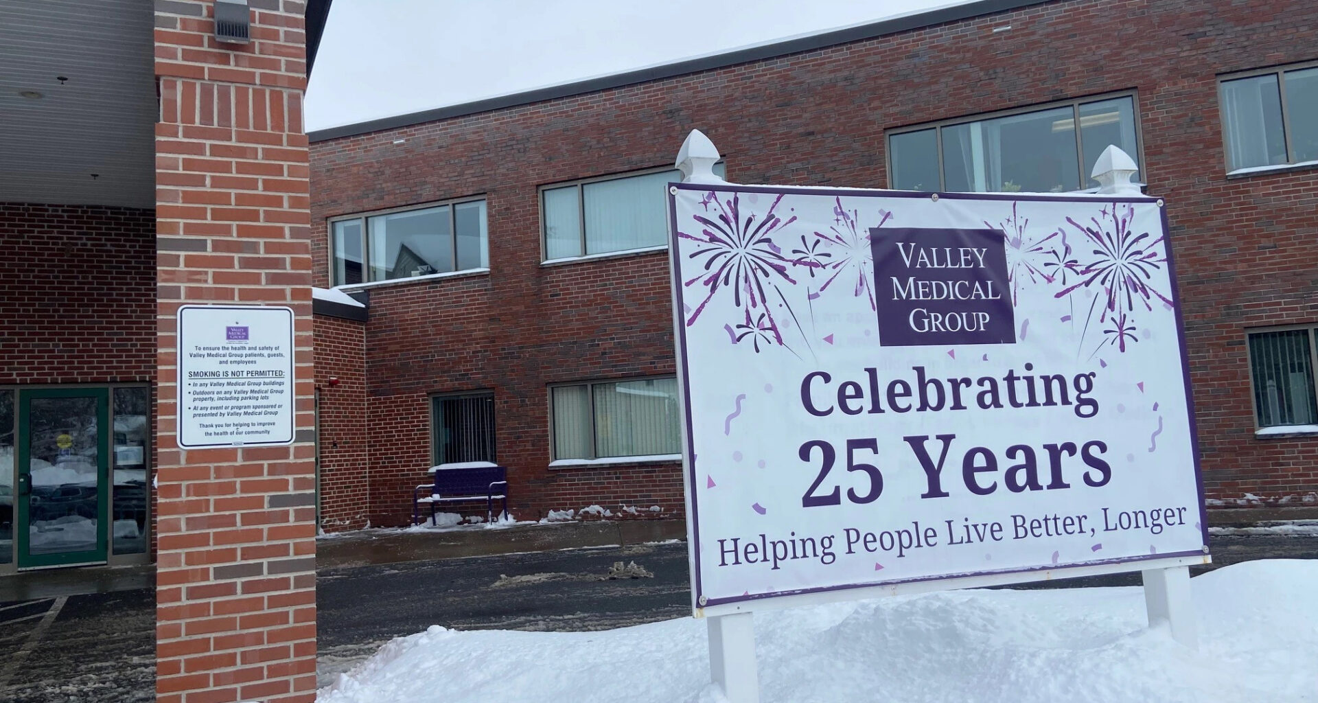 The exterior of a medical clinic with a sign reading "Celebrating 25 years"