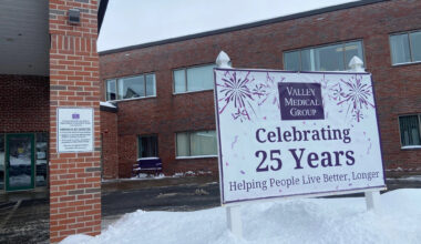 The exterior of a medical clinic with a sign reading "Celebrating 25 years"