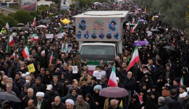 Iranians follow a truck carrying the coffins of Iran's intelligence minister Esmail Khatib and, according to Iranian officials, his wife and daughter, during a funeral procession in Tehran, Iran, Friday, March 20, 2026. (AP Photo/Vahid Salemi)