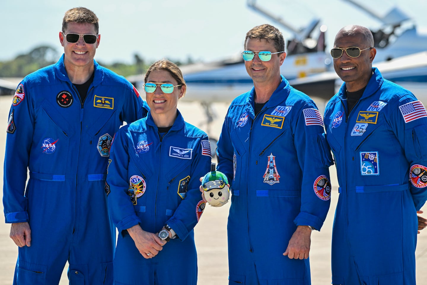 (L-R) Canadian Space Agency astronaut Mission Specialist Jeremy Hansen, NASA astronaut and Artemis II Mission Specialist Christina Koch, NASA astronaut and Artemis II Commander Reid Wiseman and NASA astronaut and Artemis II pilot Victor Glover look on during a welcome ceremony ahead of the Artemis II April 1 launch at Kennedy Space Center in Florida on March 27, 2026.