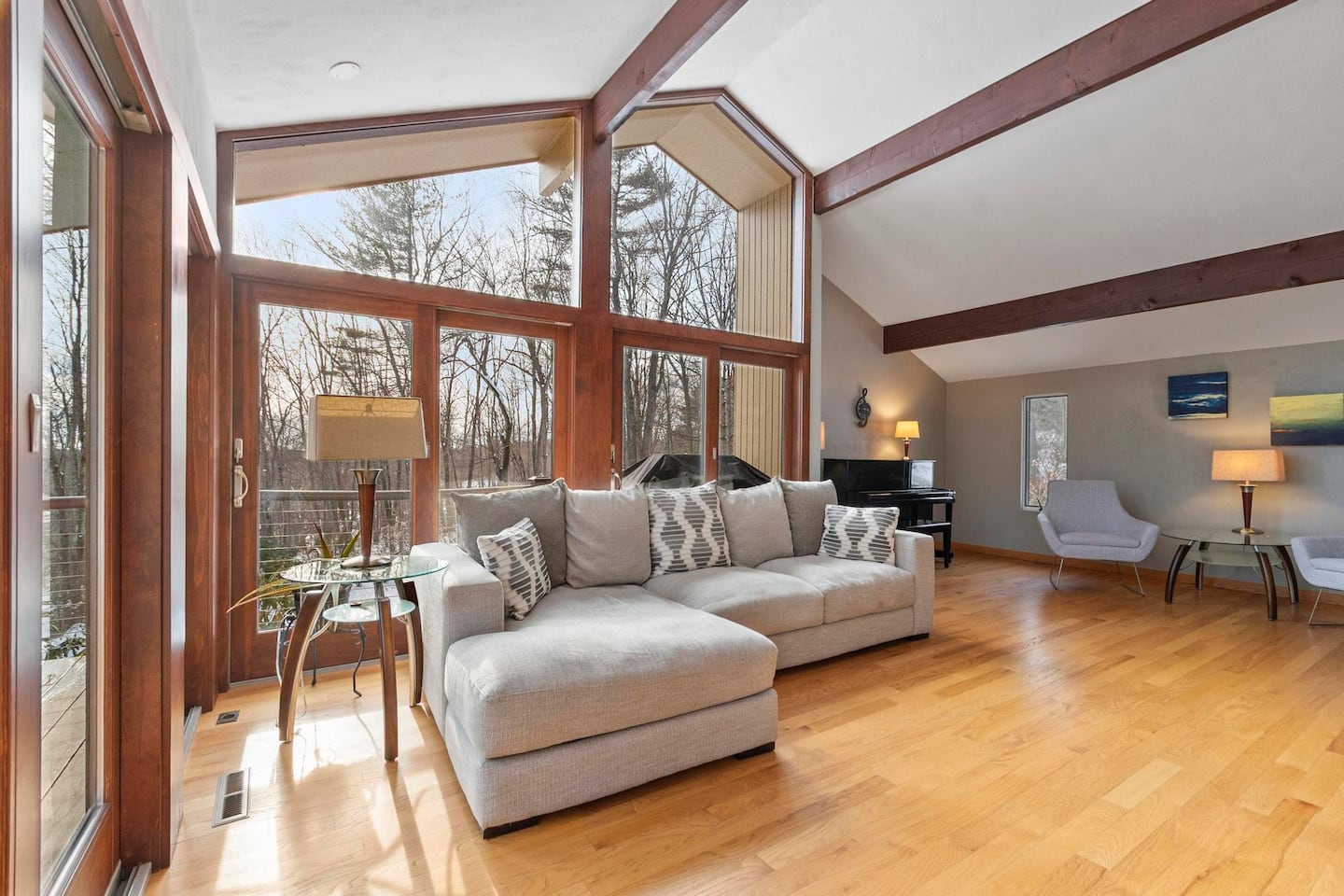 A wall of windows brightens the living room.