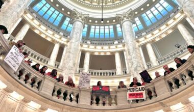 Hundreds of Idahoans gathered in the rotunda of the Idaho Capitol on Jan. 12, 2026, to protest budget cuts to the state’s Medicaid program. The protest, organized by Idaho Voices for Children, took place before the governor’s State of the State Address.